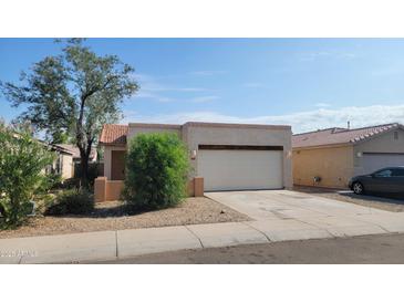 Charming single-story home featuring a two-car garage and desert landscaping, perfect for low-maintenance living at 6630 W Superior Ave, Phoenix, AZ 85043