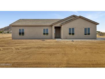 Charming single-story home with neutral stucco, a new roof, and a spacious lot at 8256 W Mccartney Rd, Casa Grande, AZ 85194