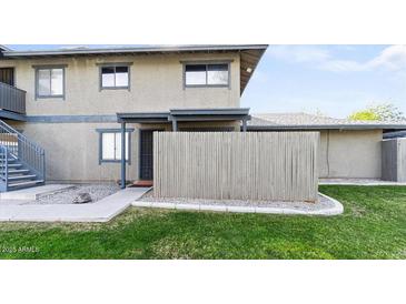 Charming townhouse features a well-maintained lawn, a fenced front yard, and a private entrance at 286 W Palomino Dr # 78, Chandler, AZ 85225