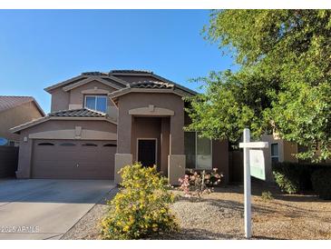 Charming two-story home featuring a well-maintained front yard and attached two-car garage at 2934 W Peggy Dr, San Tan Valley, AZ 85144