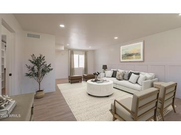 Bright living room featuring a cozy seating area, a decorative rug, and a neutral color palette at 5132 N 83Rd St, Scottsdale, AZ 85250