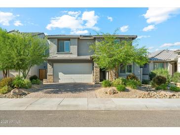 Beautiful two-story home with a two car garage and well maintained front yard landscaping at 8754 W San Juan Ave, Glendale, AZ 85305