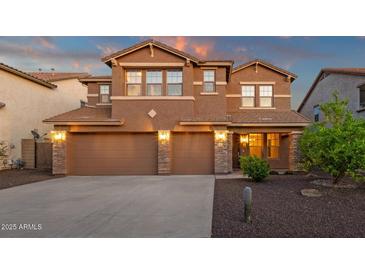 Charming two-story home featuring a three-car garage and beautiful stone accents with inviting landscape at 5223 W Bent Tree Dr, Phoenix, AZ 85083
