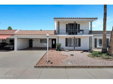 Charming two-story home with a well-maintained front yard and unique architectural details at 7632 E Bonita Dr, Scottsdale, AZ 85250