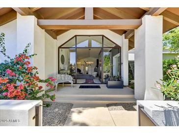 Grand entrance with a full glass door, and a view of the spacious living area, and abundant natural light at 10157 E San Salvador Dr, Scottsdale, AZ 85258