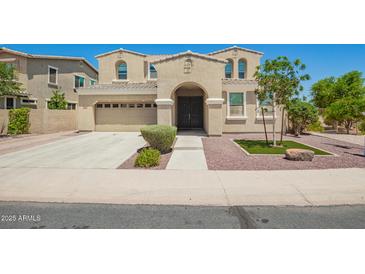 Stunning two-story home featuring a neutral stucco exterior and well-manicured landscaping at 2920 E Virginia E St, Mesa, AZ 85213