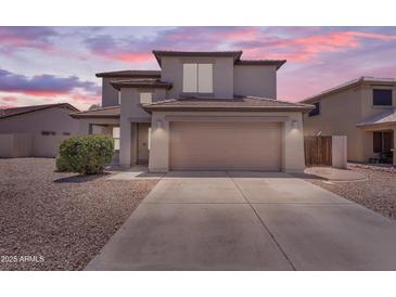 Attractive two-story home with a well-manicured yard and a two-car garage, perfect for Gathering living at 29368 N Red Finch Dr, San Tan Valley, AZ 85143