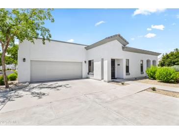 Charming single-story home featuring a two-car garage and manicured landscaping at 295 N Rural Rd # 133, Chandler, AZ 85226