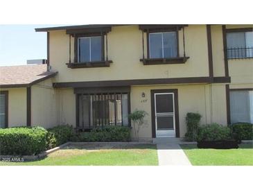 Two-story home with neutral paint, double pane windows, and minimal landscaping at 6029 N 31St Ave, Phoenix, AZ 85017