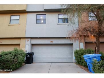 Exterior shot of a home with a two-car garage and concrete driveway at 120 W Milada Dr, Phoenix, AZ 85041