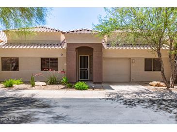 Inviting single-story home featuring a well-manicured front yard and an attached one car garage at 16450 E Avenue Of The Fountain Ave # 11, Fountain Hills, AZ 85268