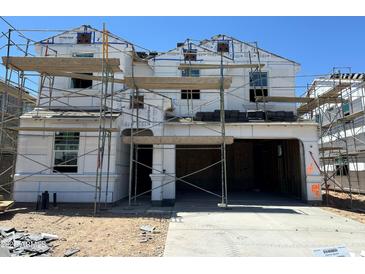 New construction two-story home showing scaffolding and exterior framework details at 7327 W Buckhorn Trl, Peoria, AZ 85383