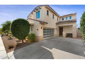 Inviting two-story home featuring a well-manicured front yard and a convenient two-car garage at 1502 E Goldcrest St, Gilbert, AZ 85297