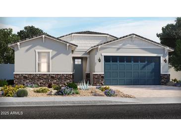 Charming single-story home with blue garage door, stone accents, and low-maintenance desert landscaping at 24405 W Grenadine Rd, Buckeye, AZ 85326
