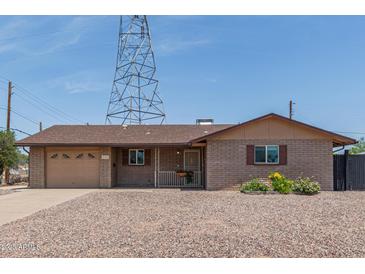 Lovely single-story home with well-maintained landscaping and neutral color scheme at 5204 E Colby St, Mesa, AZ 85205