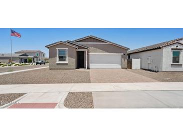 Charming single-story home featuring a low maintenance yard and brick paver driveway and neutral color palette at 18268 W La Senda Dr, Surprise, AZ 85387
