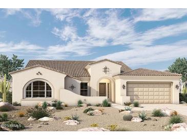 Beautiful single-story home boasting a two-car garage and a well-manicured desert landscape at 20221 W San Juan Ave, Litchfield Park, AZ 85340