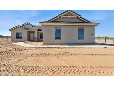 New construction home showcasing a neutral color scheme and simple landscaping at 11215 E Crescent Ave, Mesa, AZ 85208