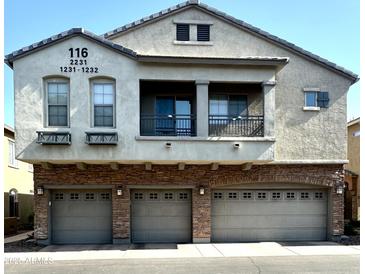 Stylish three-story home with stone accents and three-car garage at 1350 S Greenfield Rd # 2231, Mesa, AZ 85206