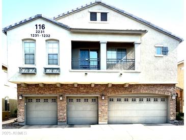 Charming two-story home featuring a three-car garage and a private second story balcony at 1350 S Greenfield Rd # 2231, Mesa, AZ 85206