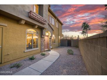 Charming two-story home with a beautiful desert landscape, enhanced by a sunset backdrop at 17150 N 23Rd St # 125, Phoenix, AZ 85022