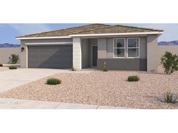Charming single-story home features a gray exterior, a two-car garage, and low maintenance desert landscaping at 18269 W Camino De Oro --, Surprise, AZ 85387