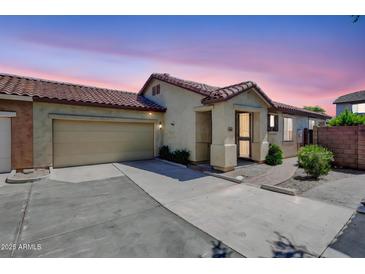 Charming single-story home featuring a tile roof and a two-car garage at sunset at 3898 E Palmer St, Gilbert, AZ 85298