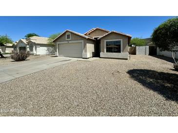 Charming single-story home with neutral stucco exterior and low-maintenance desert landscaping at 740 W Dublin St, Gilbert, AZ 85233