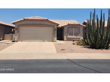 Charming single-story home with stucco siding, desert landscaping, and a two-car garage at 1450 E Doral Dr, Chandler, AZ 85249