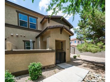 Charming front entrance featuring a private courtyard and gated access to this lovely home at 14870 W Encanto Blvd # 1059, Goodyear, AZ 85395