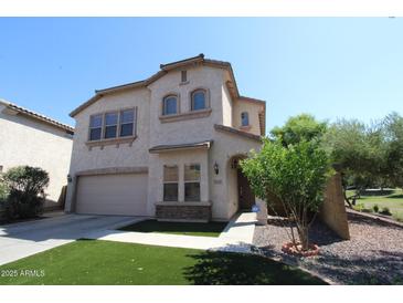 Attractive two-story stucco home with a two-car garage, manicured landscaping, and an inviting entrance at 2213 W Marconi Ave, Phoenix, AZ 85023