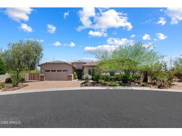 Charming single-story home with desert landscaping and a three-car garage at 31409 N 58Th Pl, Cave Creek, AZ 85331