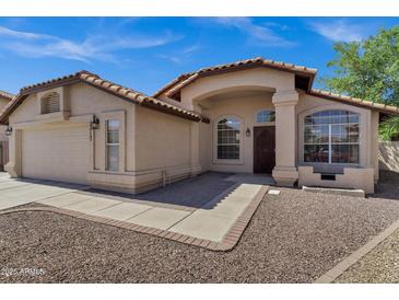 Charming single-story home featuring a tile roof, stucco exterior, and well-maintained landscaping at 1245 W Cindy St, Chandler, AZ 85224