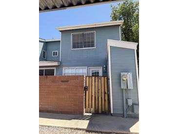 Charming two-story townhome features a private brick patio and fenced entrance for added security at 2301 E University Dr # 111, Mesa, AZ 85213