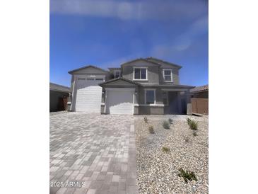 Charming two-story home with a two-car garage and paved driveway, showcasing a well-maintained facade at 18722 E Helian Dr, Gold Canyon, AZ 85118