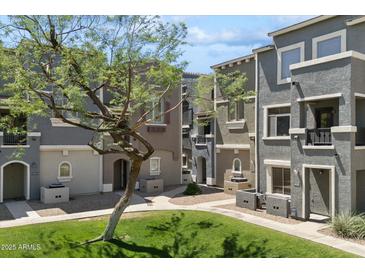Charming townhouse community with well-maintained landscaping and inviting walkways at 2401 E Rio Salado Pkwy # 1047, Tempe, AZ 85288