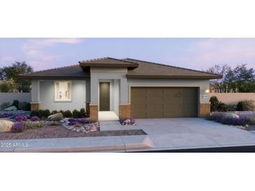 Beautiful single-story home featuring a modern design, desert landscaping, and a two-car garage at 2973 E Mecklenburg Way, San Tan Valley, AZ 85143