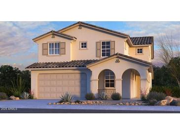 Inviting two-story home featuring a neutral color palette, attached two-car garage, and a covered front entryway at 5848 S Hassett Ave, Mesa, AZ 85212