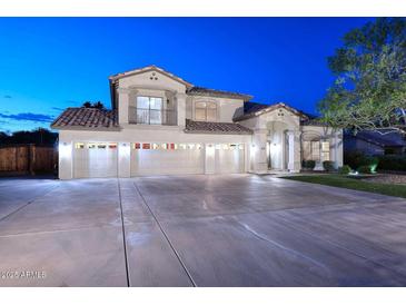 Stunning two-story home featuring a five-car garage and private balcony at 8026 W Villa Lindo Dr, Peoria, AZ 85383