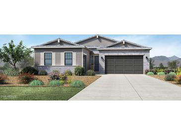 Charming single-story home featuring stone accents, a two-car garage, and a well-manicured front yard at 11139 E Ulysses Ave, Mesa, AZ 85212