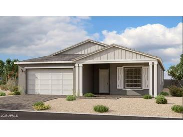 Charming single-story home featuring a two-car garage, neutral color palette, and a welcoming front porch at 11338 E Utah Ave, Mesa, AZ 85212