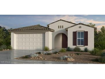 Charming single-story home showcasing stucco siding, a two-car garage, and low-maintenance landscaping at 25252 N 169Th Dr, Surprise, AZ 85387