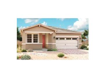 Charming single-story home featuring a two-car garage, neutral colors, and a well-manicured front yard at 39994 W Anne Ln, Maricopa, AZ 85138