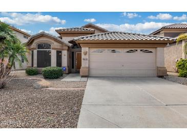 Charming single-Gathering home featuring a desert landscape and a spacious two-car garage at 9631 E Palm Ridge Dr, Scottsdale, AZ 85260
