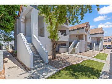Charming two-story home featuring a red tile roof and well-maintained landscaping at 1800 W Elliot Rd # 240, Chandler, AZ 85224