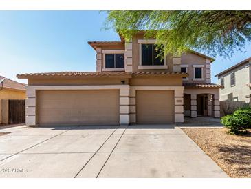 Inviting two-story home with a spacious three-car garage and well-maintained landscaping at 2918 E Silverbell Rd, San Tan Valley, AZ 85143