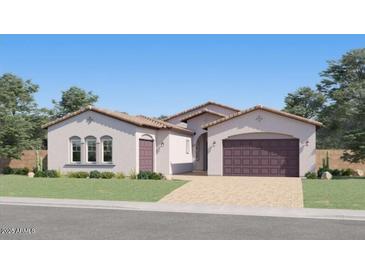 Inviting single-story home with arched windows, a paver driveway, and a 2-car garage providing great curb appeal at 25162 N 177Th Dr, Surprise, AZ 85387