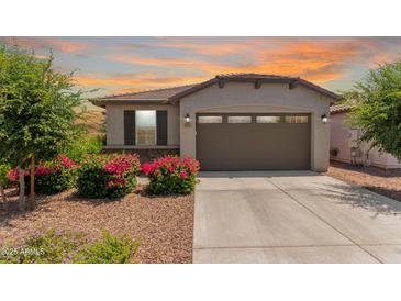 Charming single-story home boasts a desert landscape, two-car garage, and delightful curb appeal at 9325 W Montecito Ave, Phoenix, AZ 85037