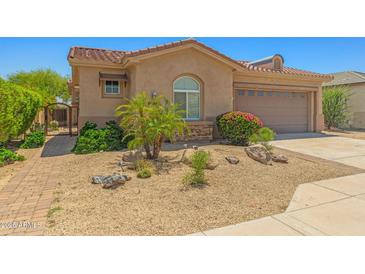 Charming single-Gathering home featuring a well-manicured desert landscape and a two-car garage at 14333 W Alvarado Dr, Goodyear, AZ 85395