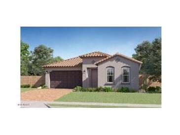 Charming single-story home featuring a tile roof, a two-car garage, and a well-maintained lawn at 15883 W Winslow Ave, Goodyear, AZ 85338